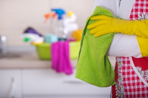 Staff member wearing PPE while carrying out a cleaning job