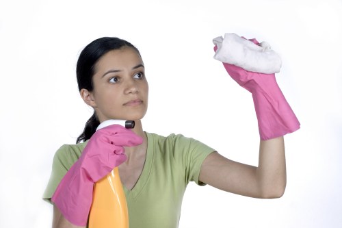 Trained cleaner preparing equipment for a safe cleaning task